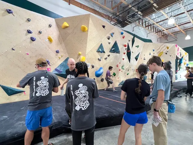 competition climbers and judge